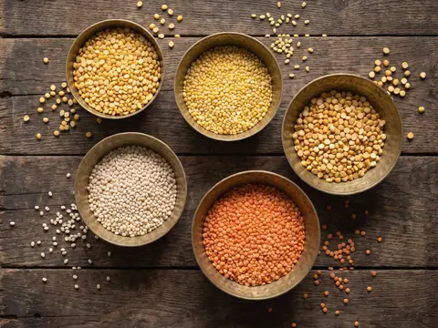 Five brass bowls of split toor, moong, chana, urad and masoor dal